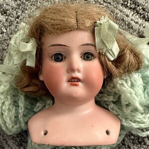 Vintage Porcelain Doll Head with Green Ribbons